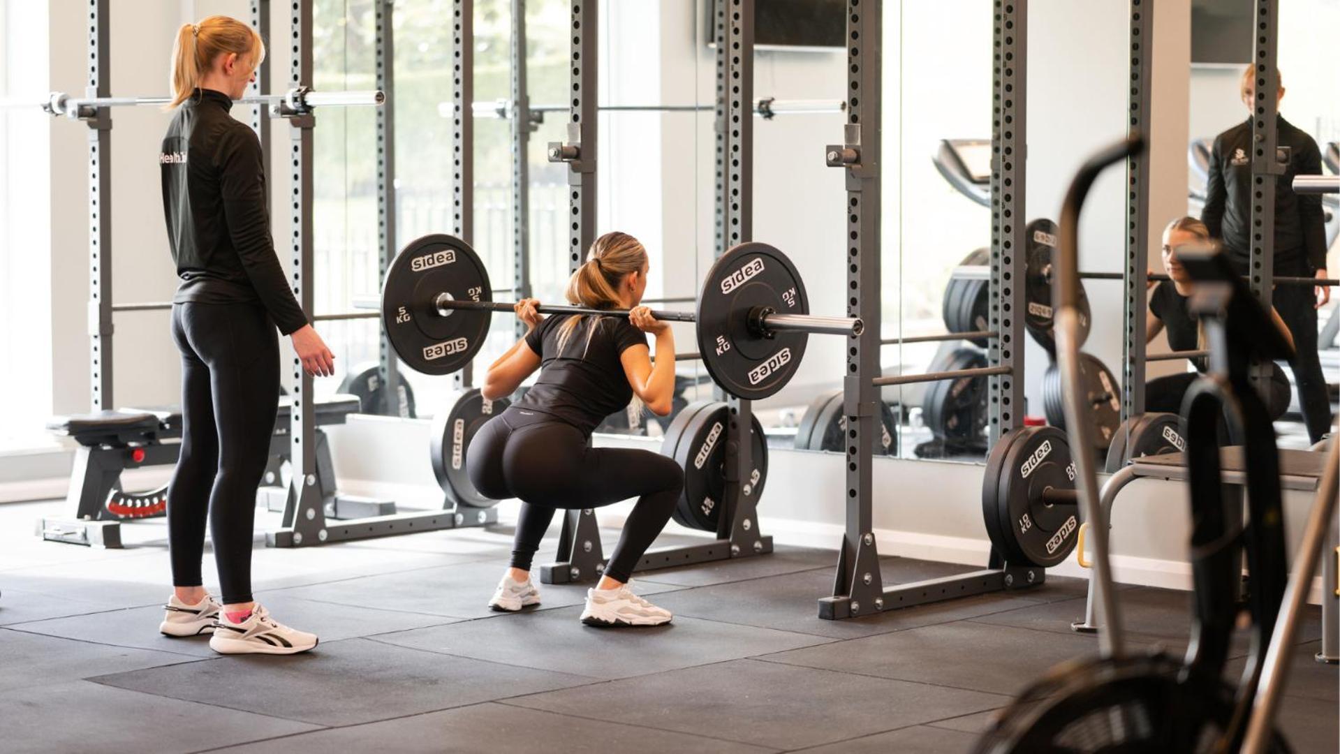 The Culloden Estate And Spa Holywood  Exterior photo A woman performing a back squat with a barbell
